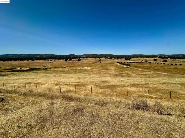a view of a road with a building in the background