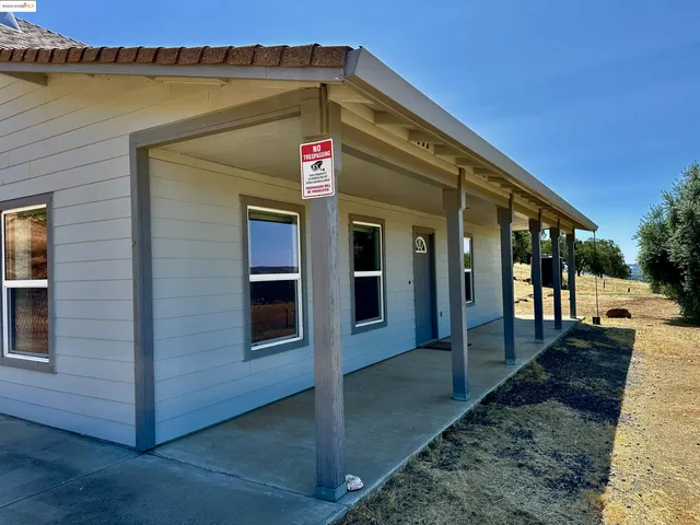 a front view of a house with lake view