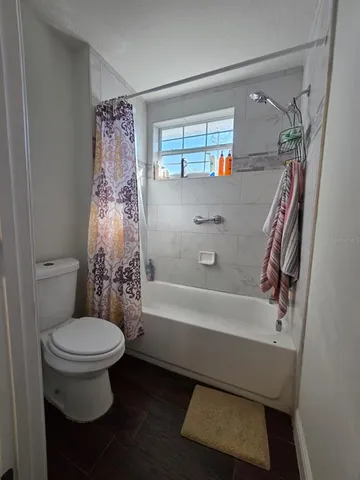 a bathroom with a granite countertop double vanity sink and mirror