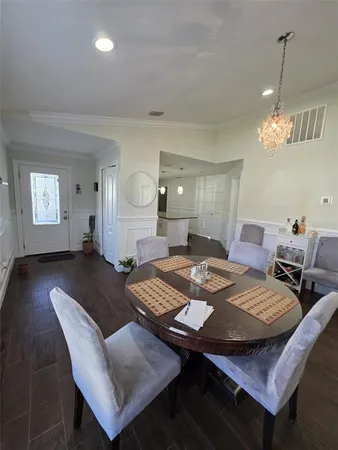 a kitchen with stainless steel appliances granite countertop a sink stove and wooden floor