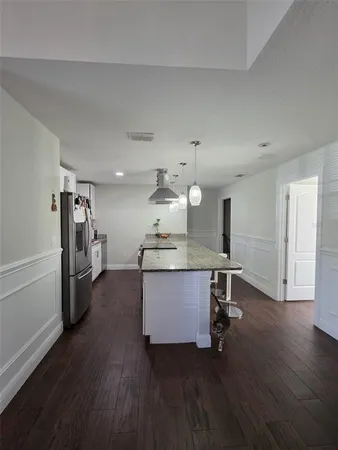 a kitchen with a table and chairs in it