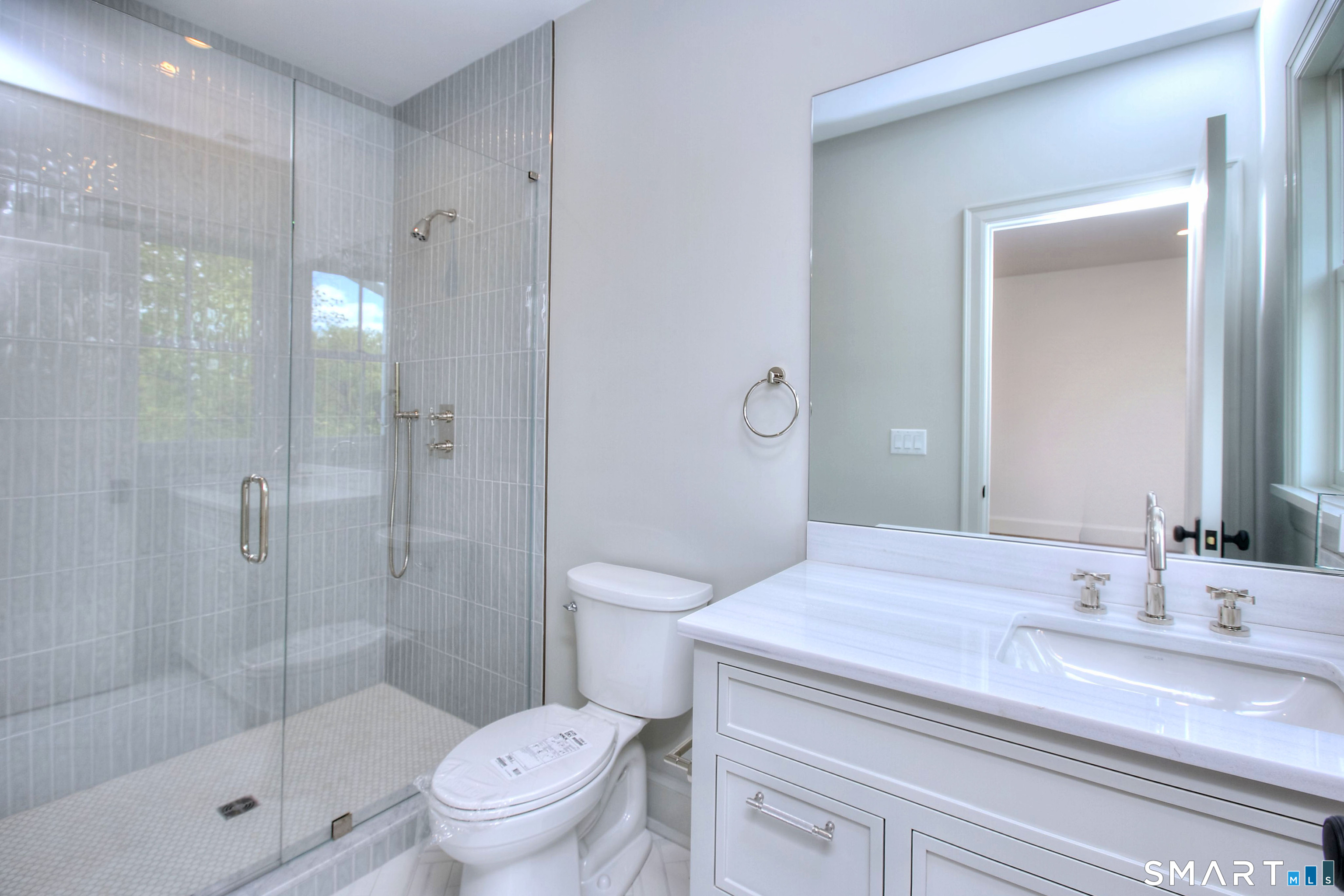 48 Kettle Creek Road Weston, CT 06883 - Photo 30 of 40 a bathroom with a sink a toilet and shower