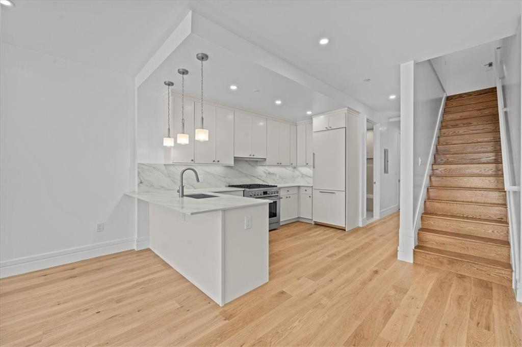 147 Luquer Street, Unit 1 Brooklyn, NY 11231 - Photo 4 of 26 Kitchen/ Stairs to primary bedroom