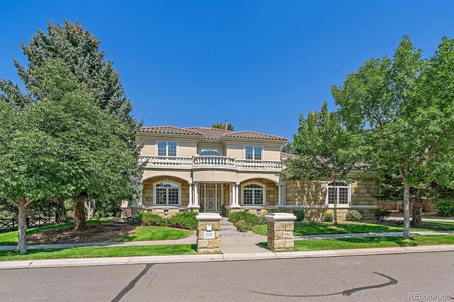 a front view of building with yard