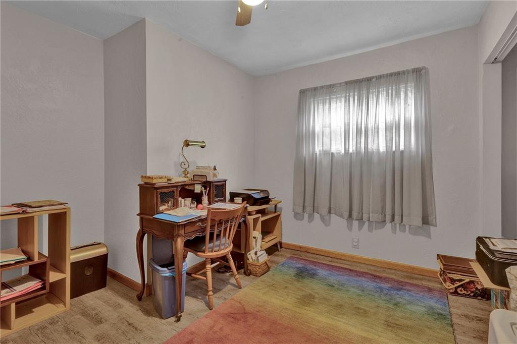 754 Wolf Avenue Rochester, PA 15074 - Photo 13 of 25 a view of a workspace with furniture and a window