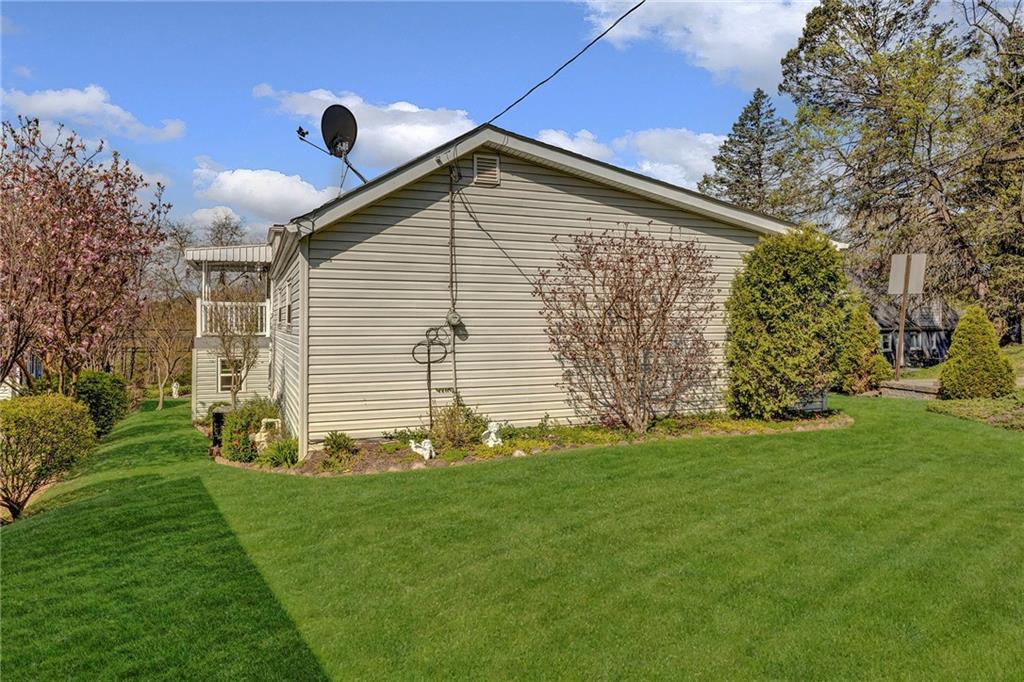 754 Wolf Avenue Rochester, PA 15074 - Photo 23 of 25 a front view of a house with a garden
