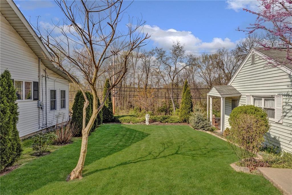 754 Wolf Avenue Rochester, PA 15074 - Photo 24 of 25 a front view of a house with garden