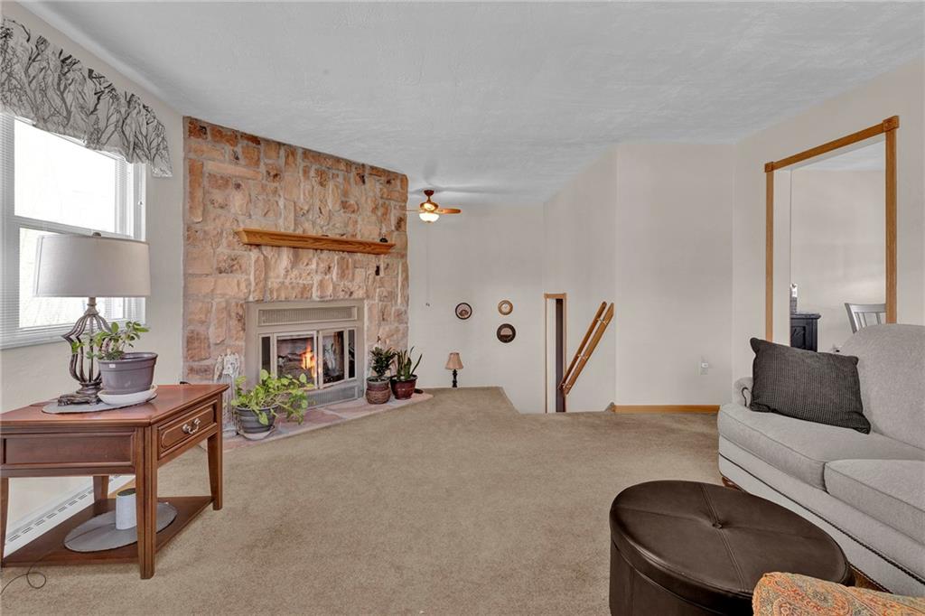 754 Wolf Avenue Rochester, PA 15074 - Photo 5 of 25 a living room with furniture and a fireplace