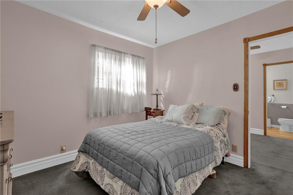 754 Wolf Avenue Rochester, PA 15074 - Photo 9 of 25 a bedroom with a bed and a chandelier