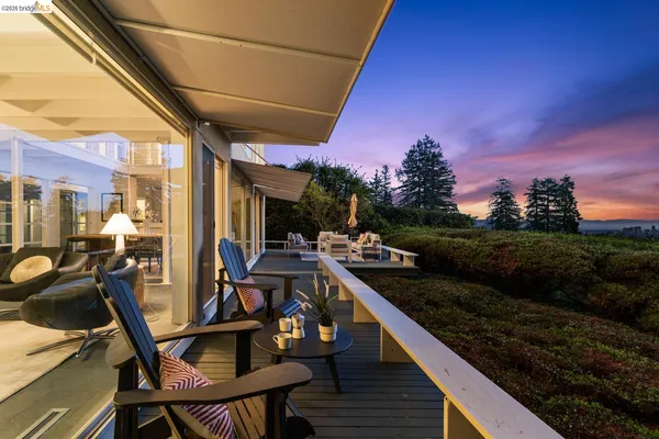 a view of a balcony with chairs