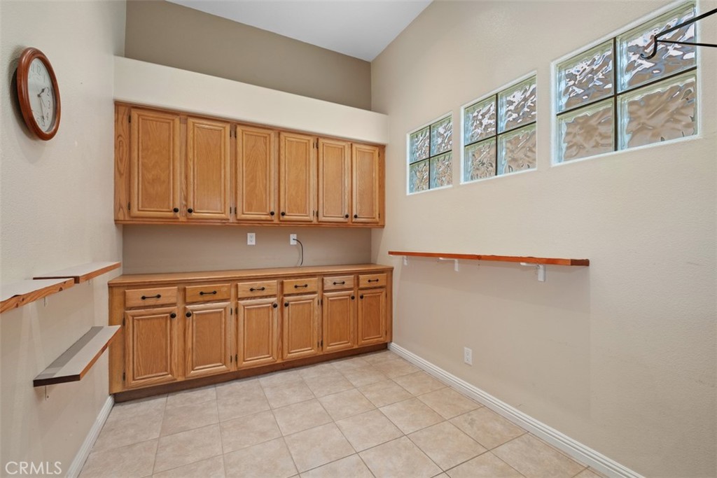 35 Vía Encanto Rancho Santa Margarita, CA 92688 - Photo 14 of 40 a kitchen with a cabinets and a stove top oven
