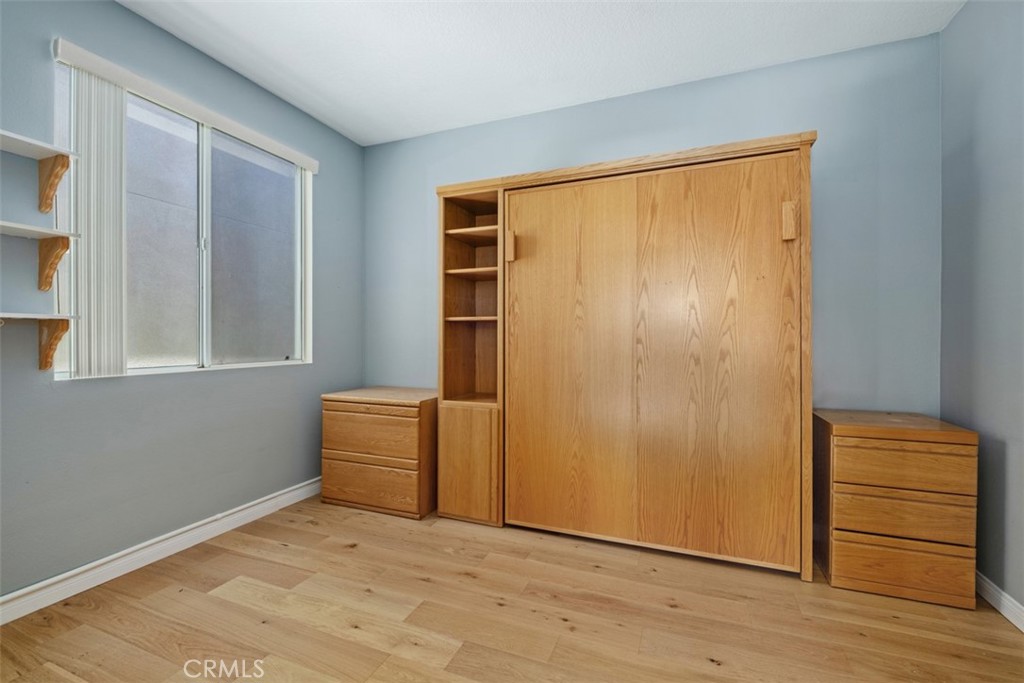 35 Vía Encanto Rancho Santa Margarita, CA 92688 - Photo 18 of 40 a view of an empty room with wooden floor and a window