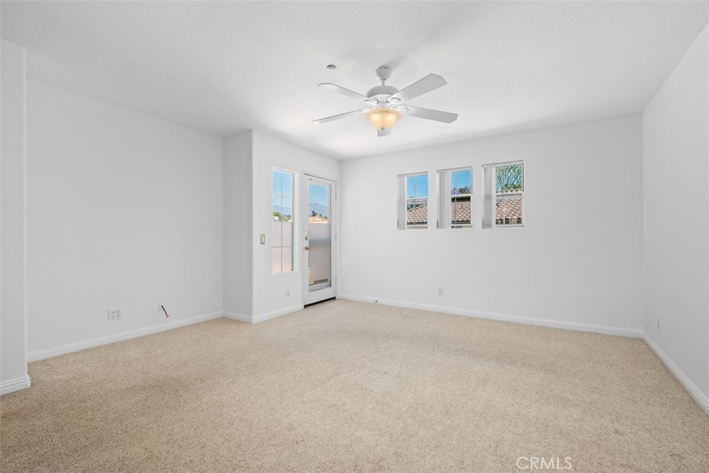 35 Vía Encanto Rancho Santa Margarita, CA 92688 - Photo 20 of 40 an empty room with windows and fan