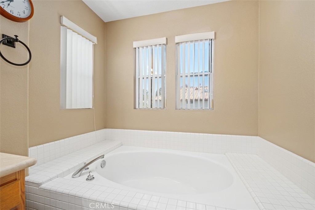 35 Vía Encanto Rancho Santa Margarita, CA 92688 - Photo 23 of 40 a bathroom with a bathtub and a window