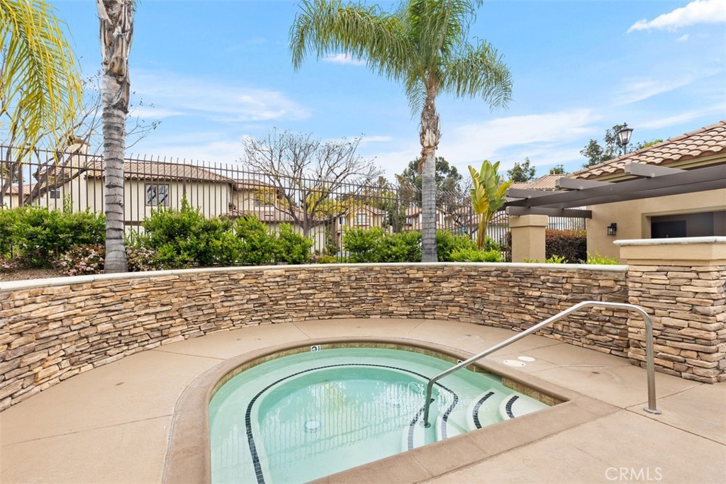 35 Vía Encanto Rancho Santa Margarita, CA 92688 - Photo 34 of 40 a view of swimming pool with a yard and palm trees