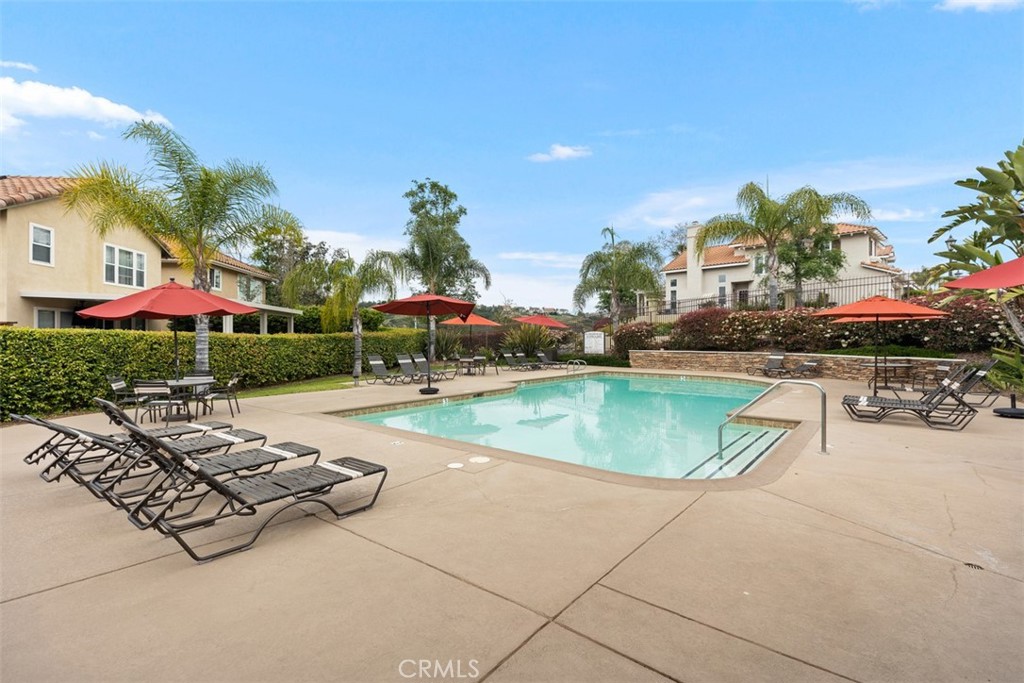 35 Vía Encanto Rancho Santa Margarita, CA 92688 - Photo 35 of 40 a swimming pool with outdoor seating and yard