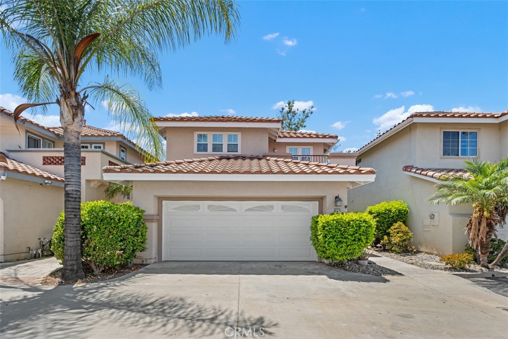 35 Vía Encanto Rancho Santa Margarita, CA 92688 - Photo 36 of 40 a front view of a house with a garden