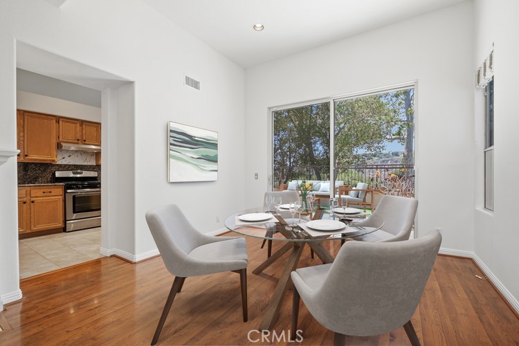 35 Vía Encanto Rancho Santa Margarita, CA 92688 - Photo 37 of 40 a dining room with furniture and wooden floor
