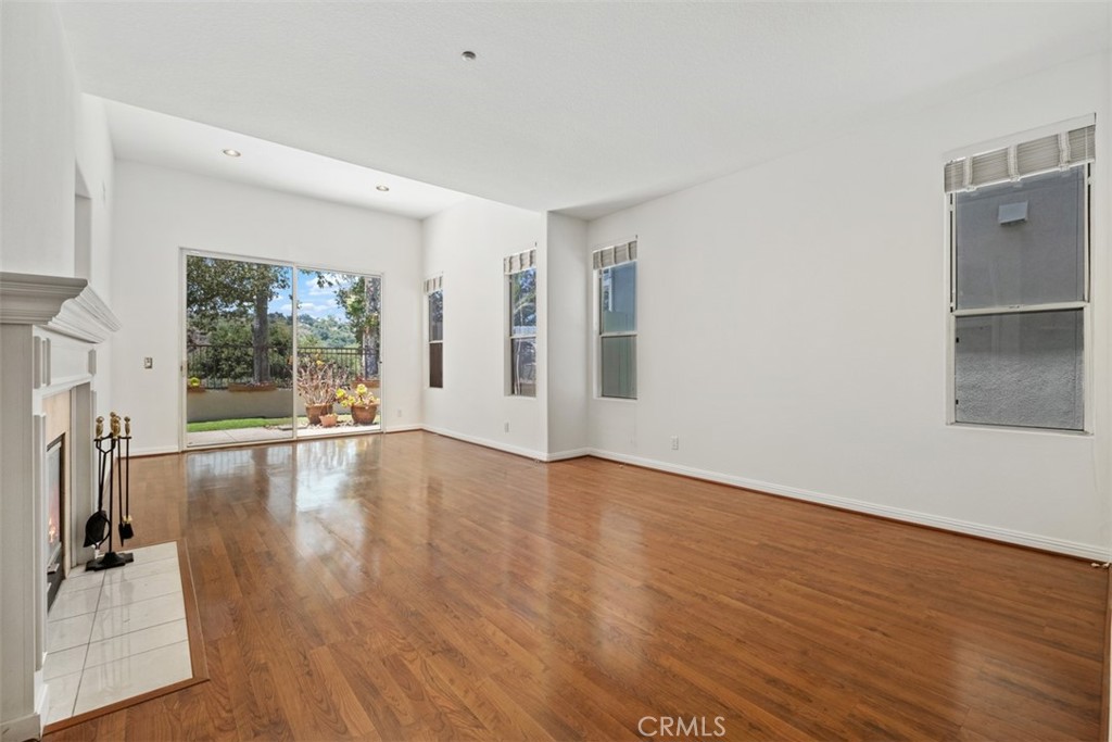 35 Vía Encanto Rancho Santa Margarita, CA 92688 - Photo 5 of 40 an empty room with wooden floor and windows