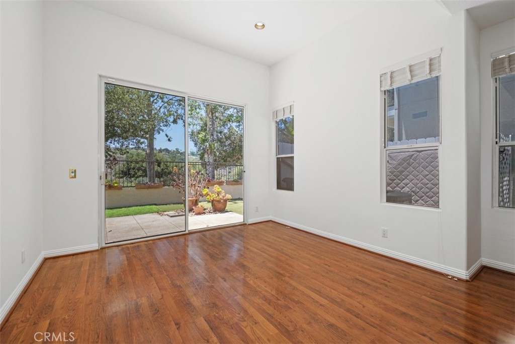 35 Vía Encanto Rancho Santa Margarita, CA 92688 - Photo 9 of 40 a view of an empty room with wooden floor and a window