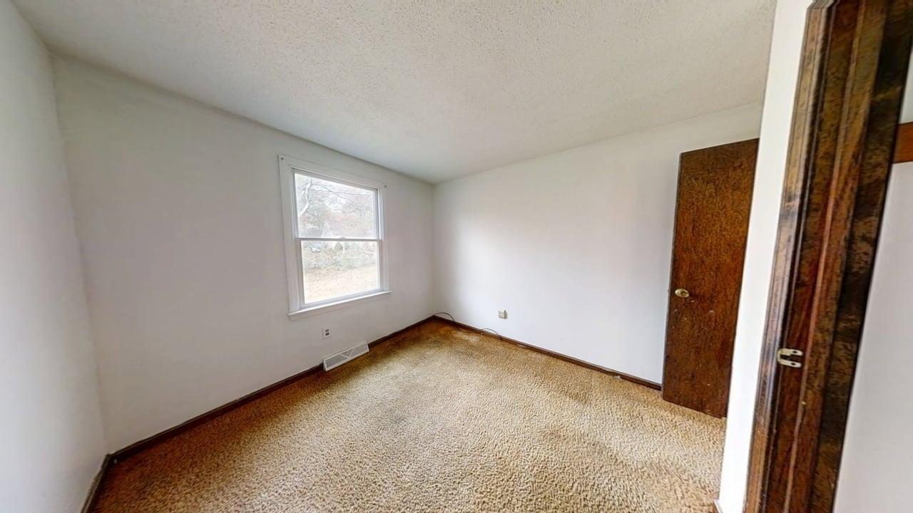 765 Millstone Road Brewster, MA 02631 - Photo 11 of 16 an empty room with windows