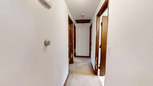 a view of hallway with shower