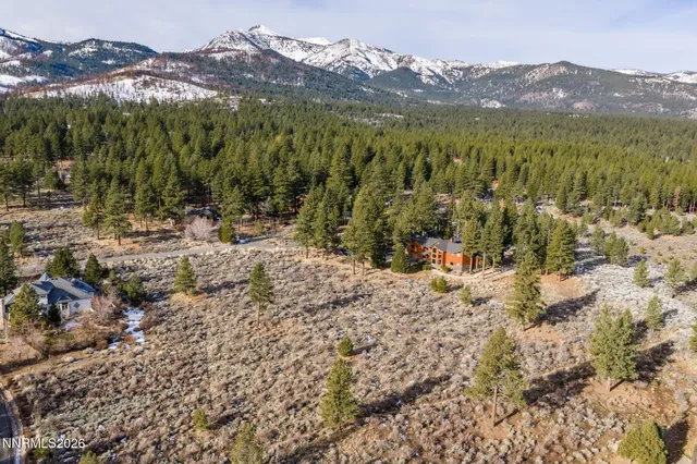 a view of a town with mountains in the background