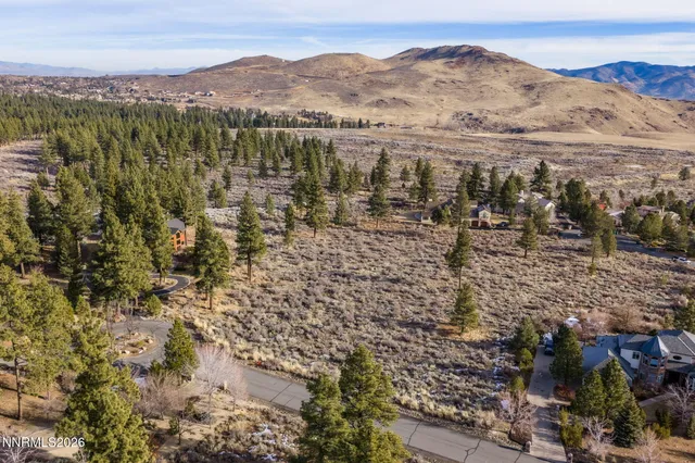 a view of a town with mountains in the background