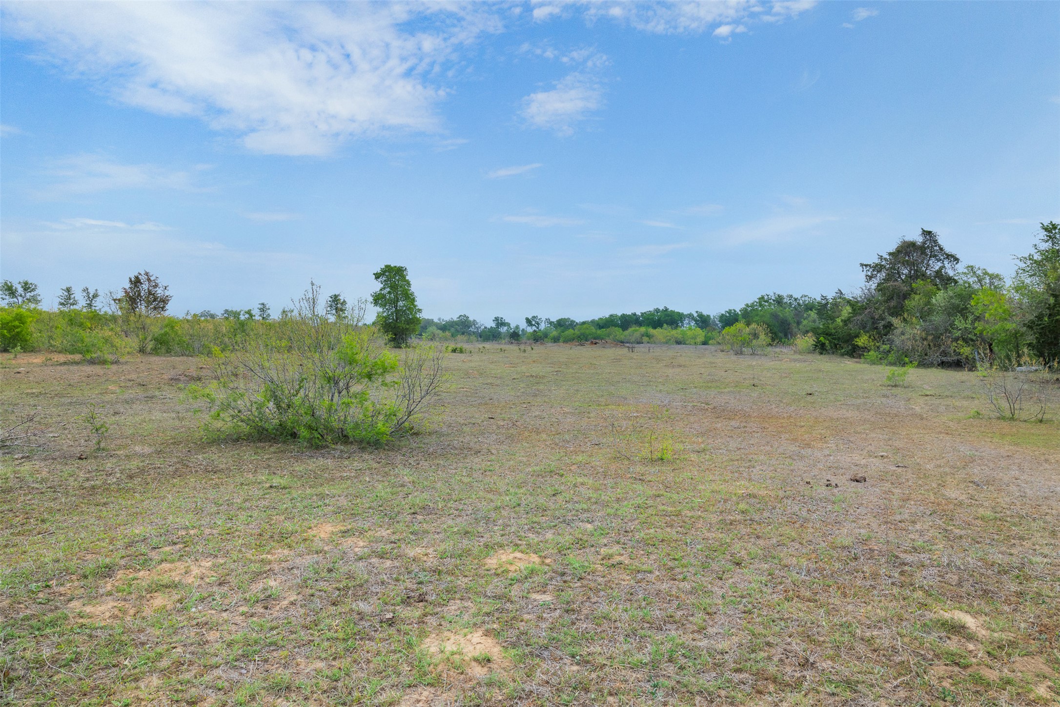 579 Lower Elgin Road Elgin, TX 78621 - Photo 21 of 40 a view of a lake with houses in the back