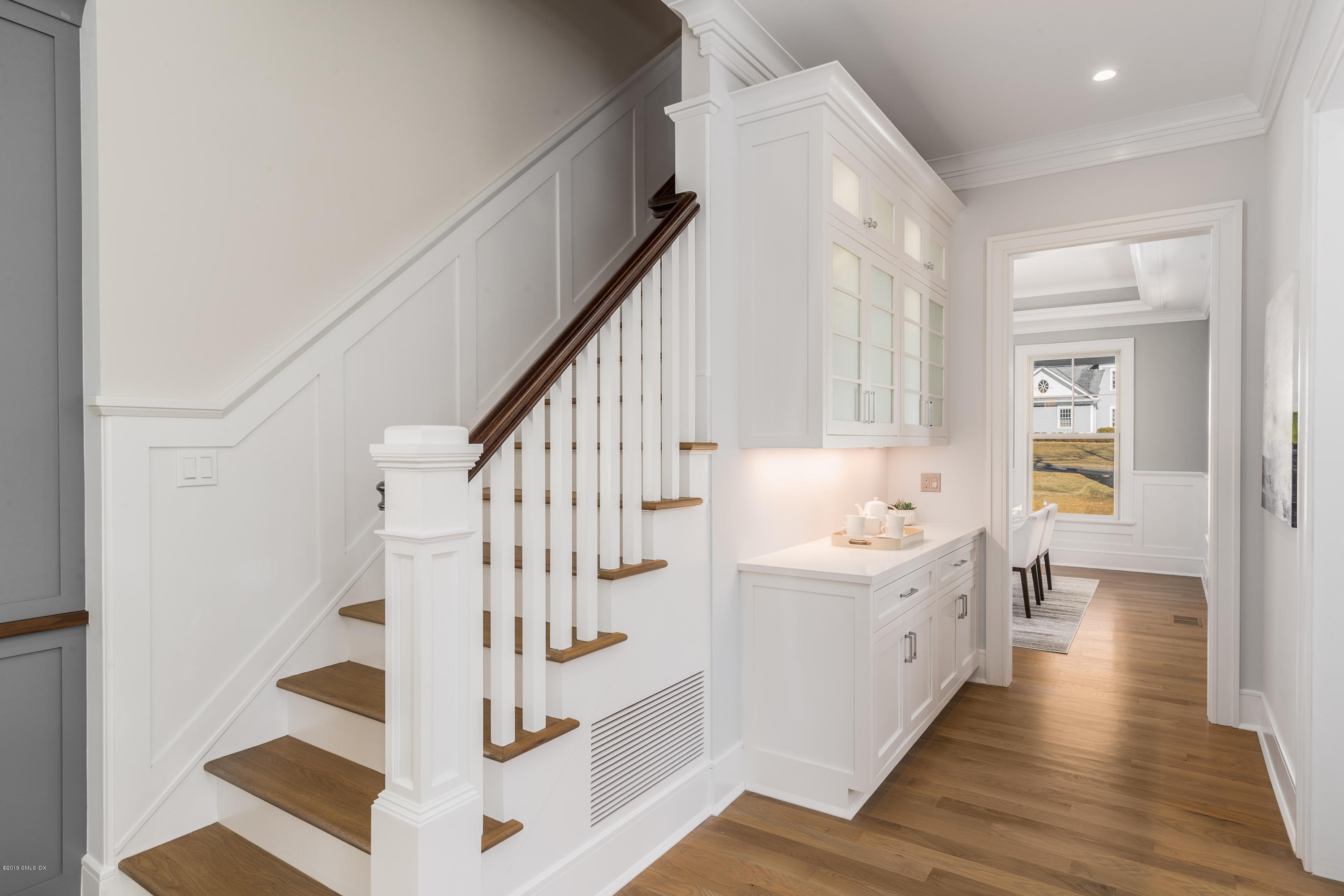 22 Mimosa Drive Cos Cob, CT 06807 - Photo 14 of 27 a view of entryway with wooden floor and windows