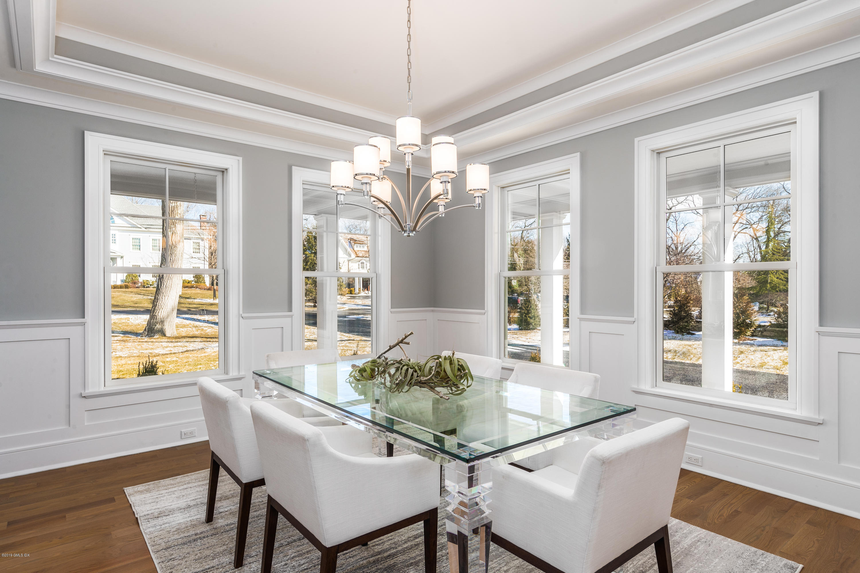 22 Mimosa Drive Cos Cob, CT 06807 - Photo 15 of 27 a dining room with furniture a chandelier and wooden floor