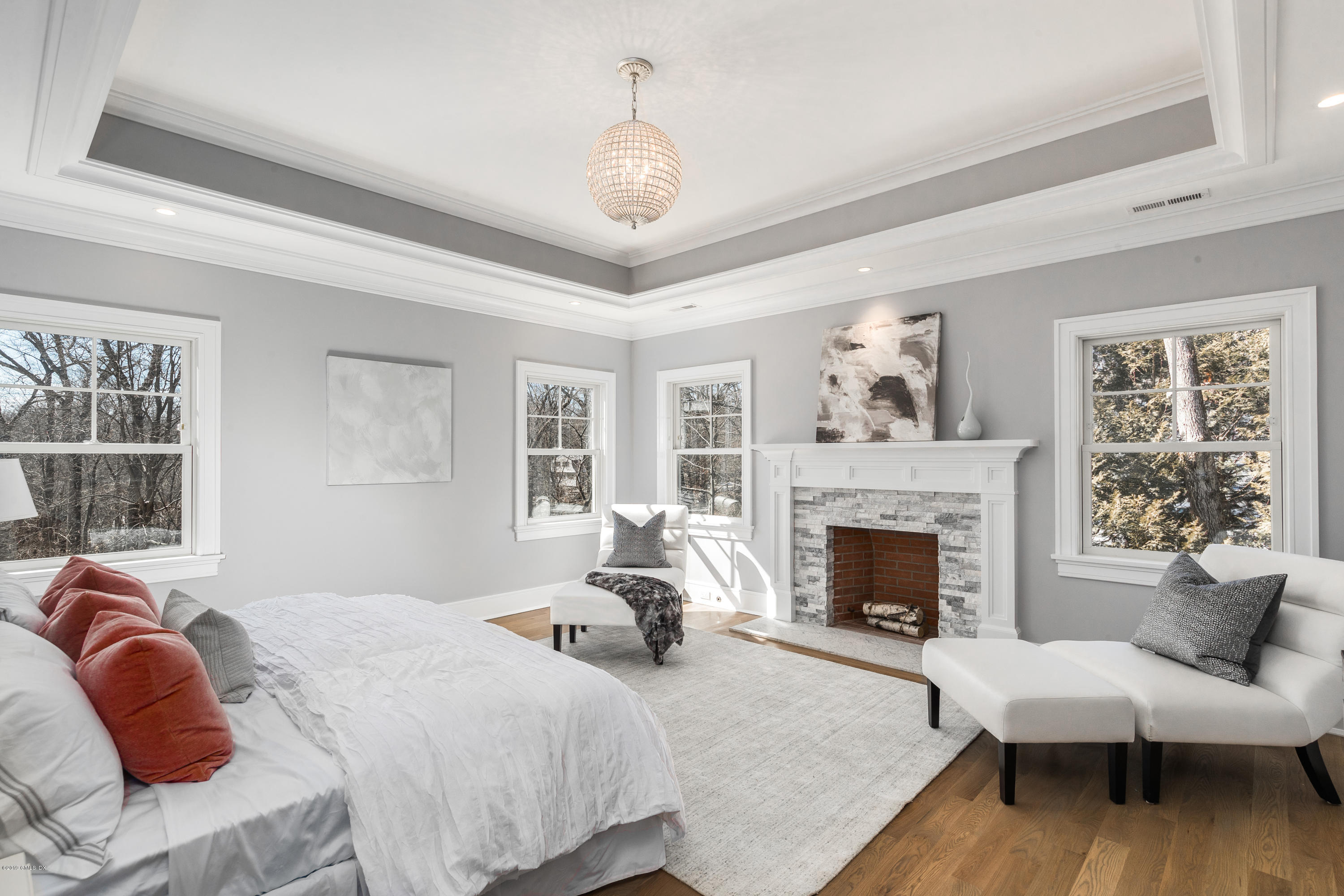 22 Mimosa Drive Cos Cob, CT 06807 - Photo 17 of 27 a bedroom with a bed and a fireplace