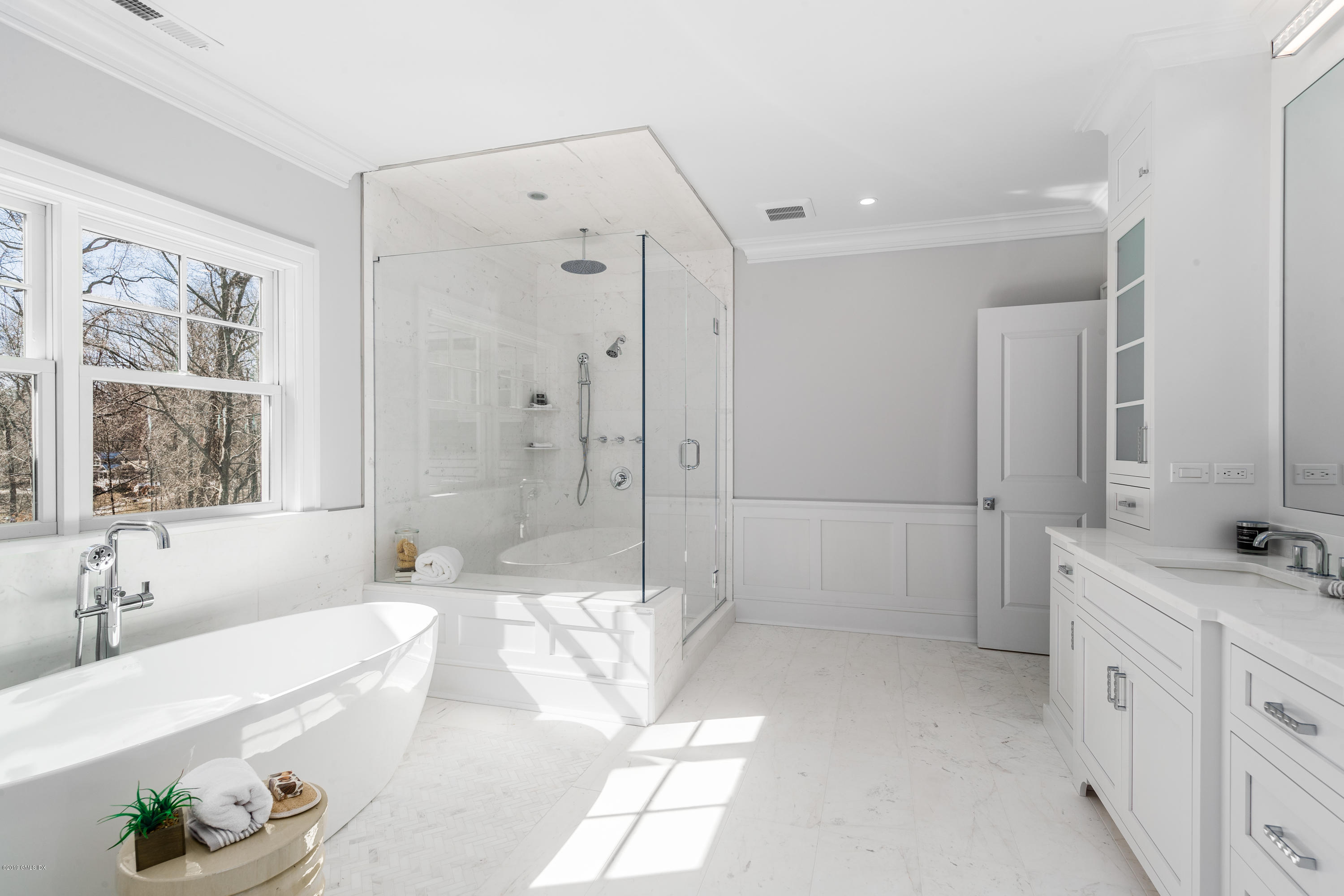 22 Mimosa Drive Cos Cob, CT 06807 - Photo 19 of 27 a spacious bathroom with a tub sink shower and two mirror