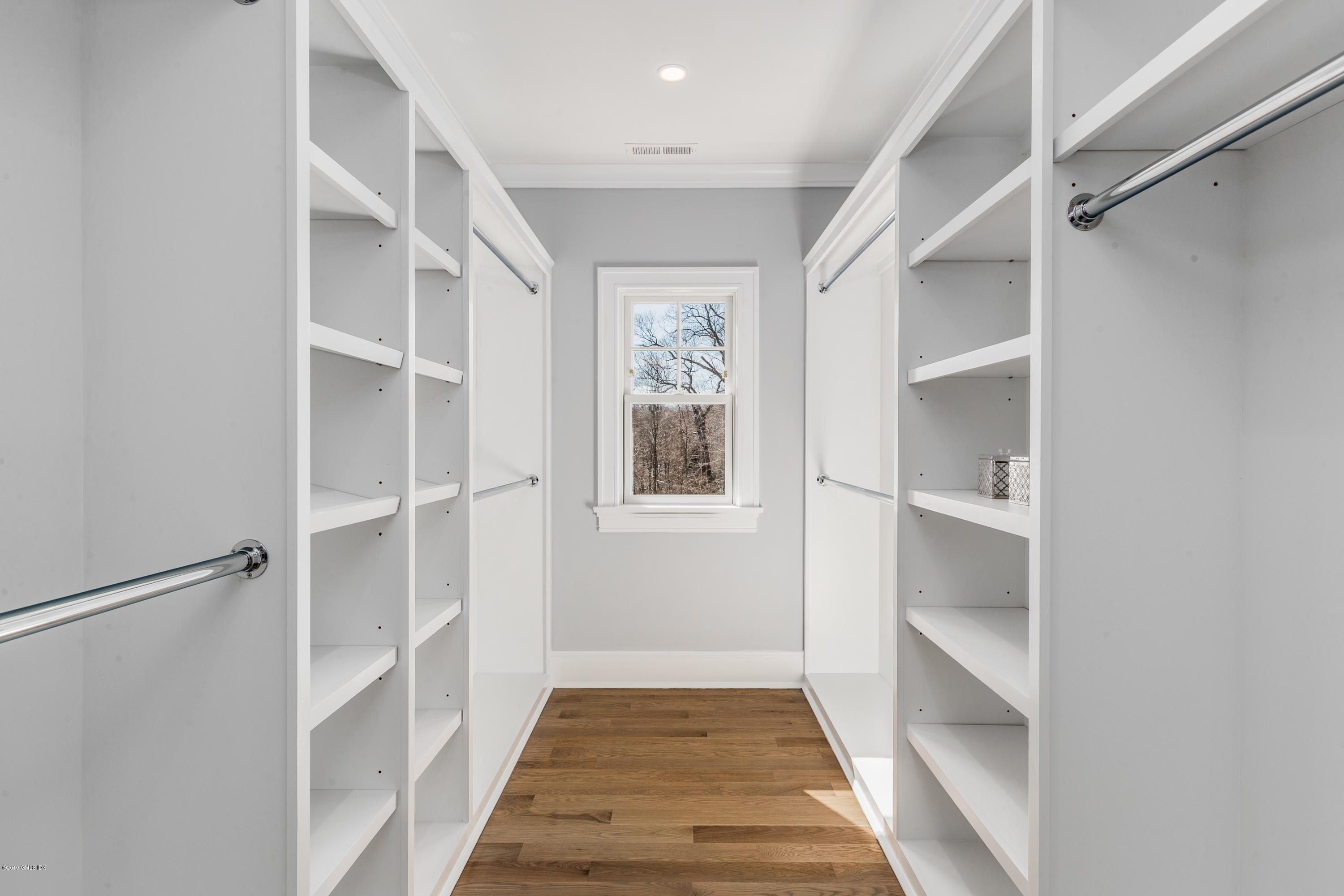 22 Mimosa Drive Cos Cob, CT 06807 - Photo 21 of 27 a view of an entryway with wooden floor and cabinet