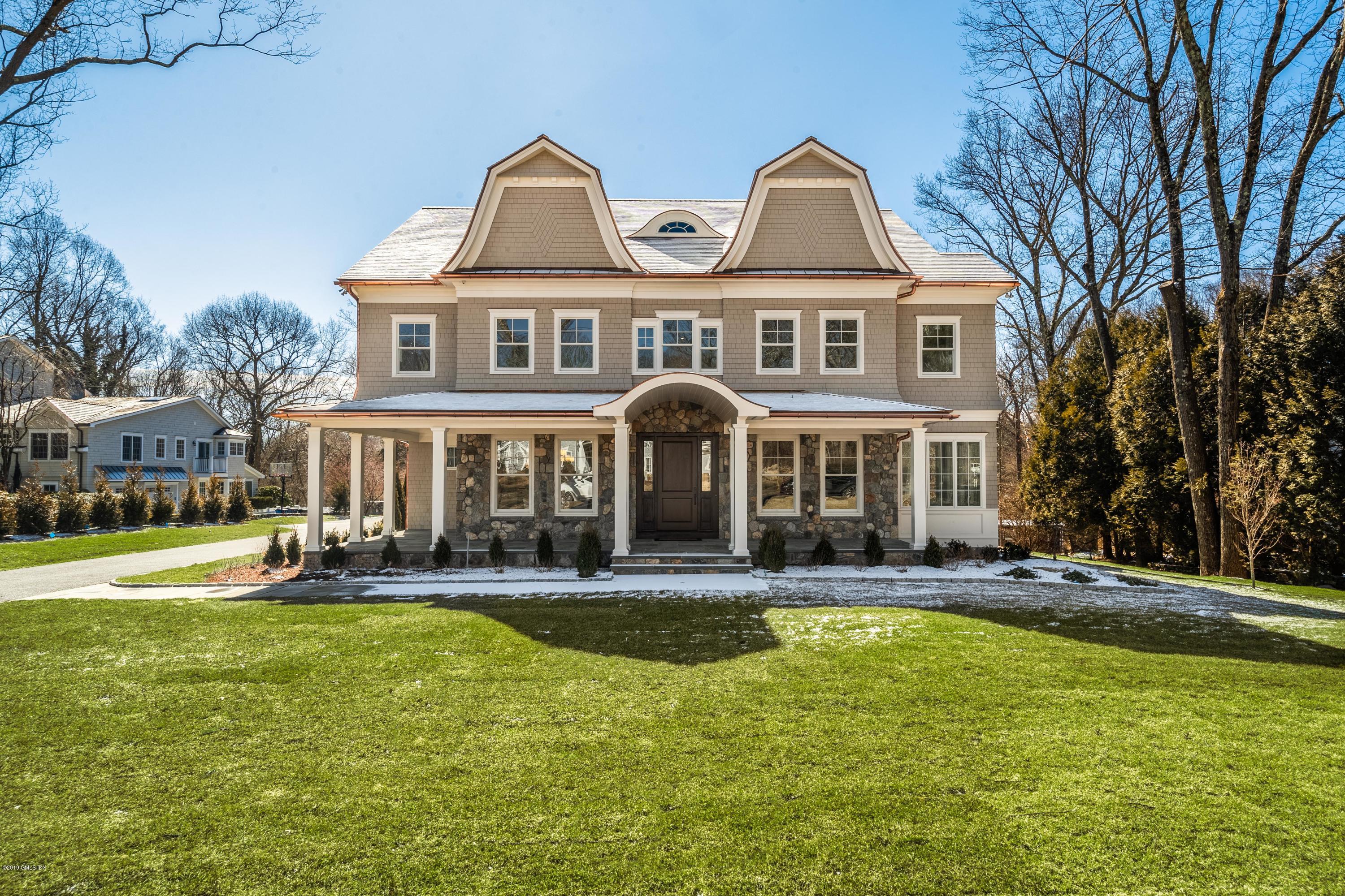 22 Mimosa Drive Cos Cob, CT 06807 - Photo 24 of 27 a front view of a house with swimming pool and porch