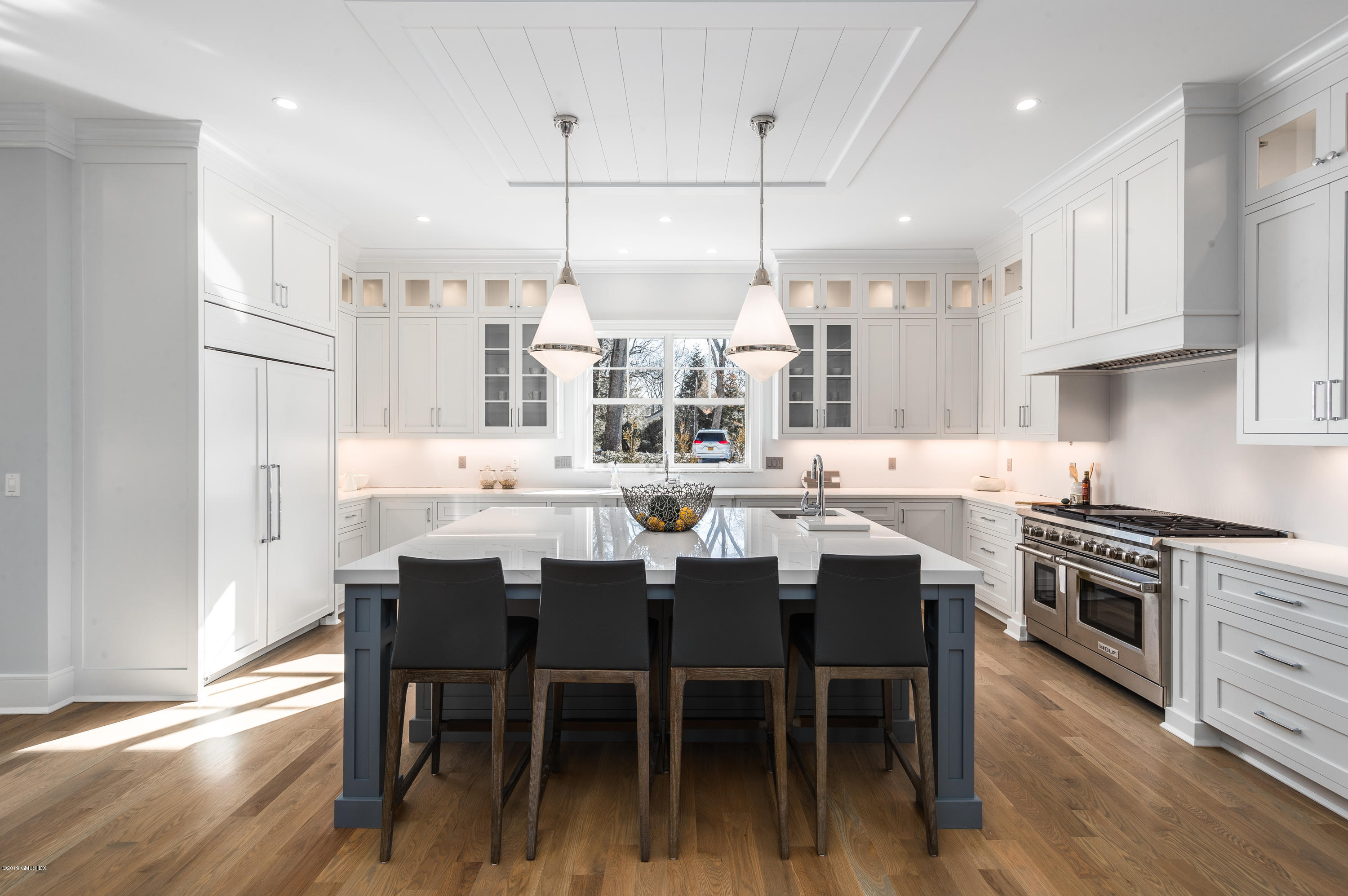 22 Mimosa Drive Cos Cob, CT 06807 - Photo 8 of 27 a large kitchen with a table and chairs