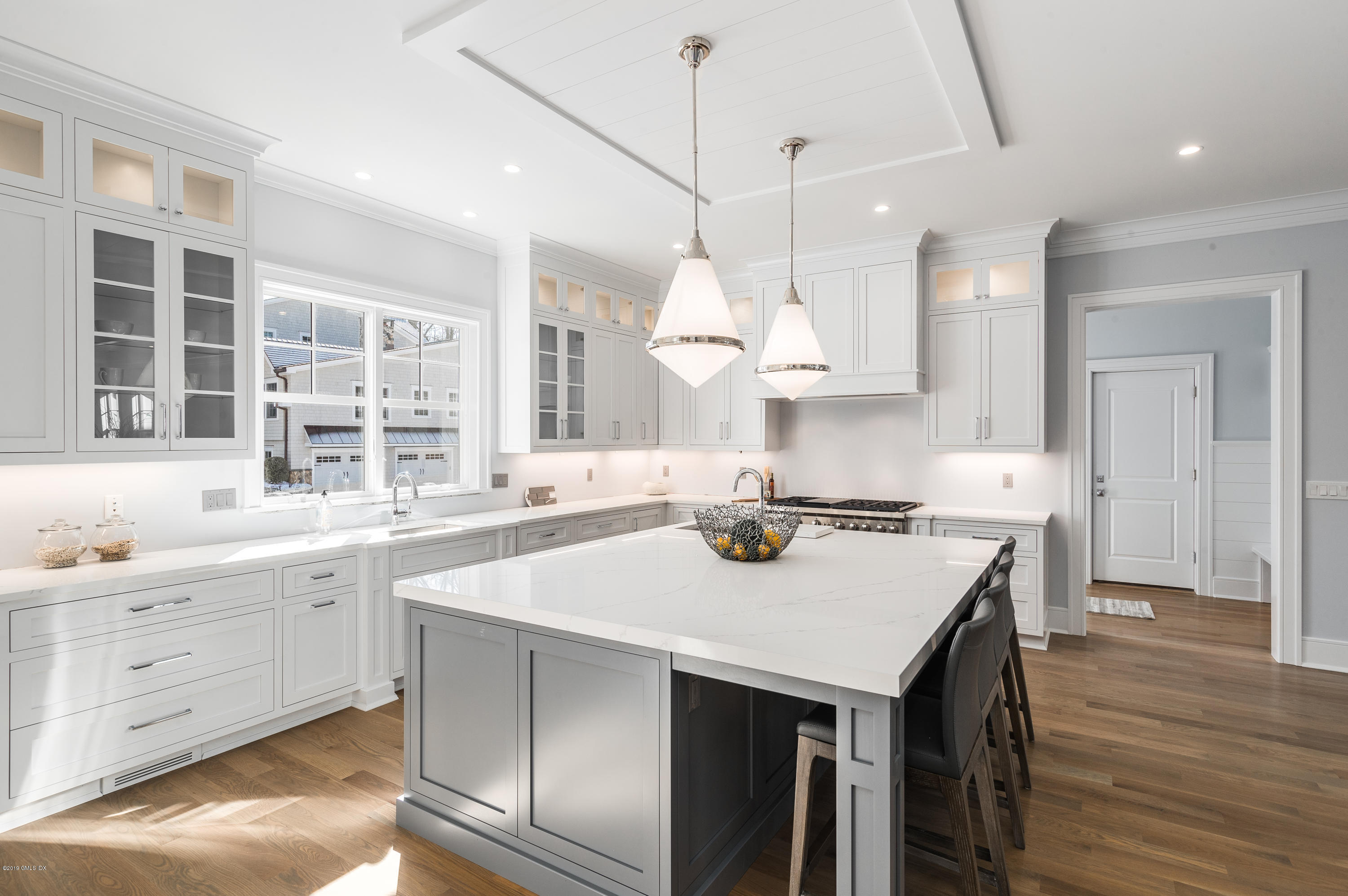 22 Mimosa Drive Cos Cob, CT 06807 - Photo 9 of 27 a kitchen with a stove a sink and a refrigerator