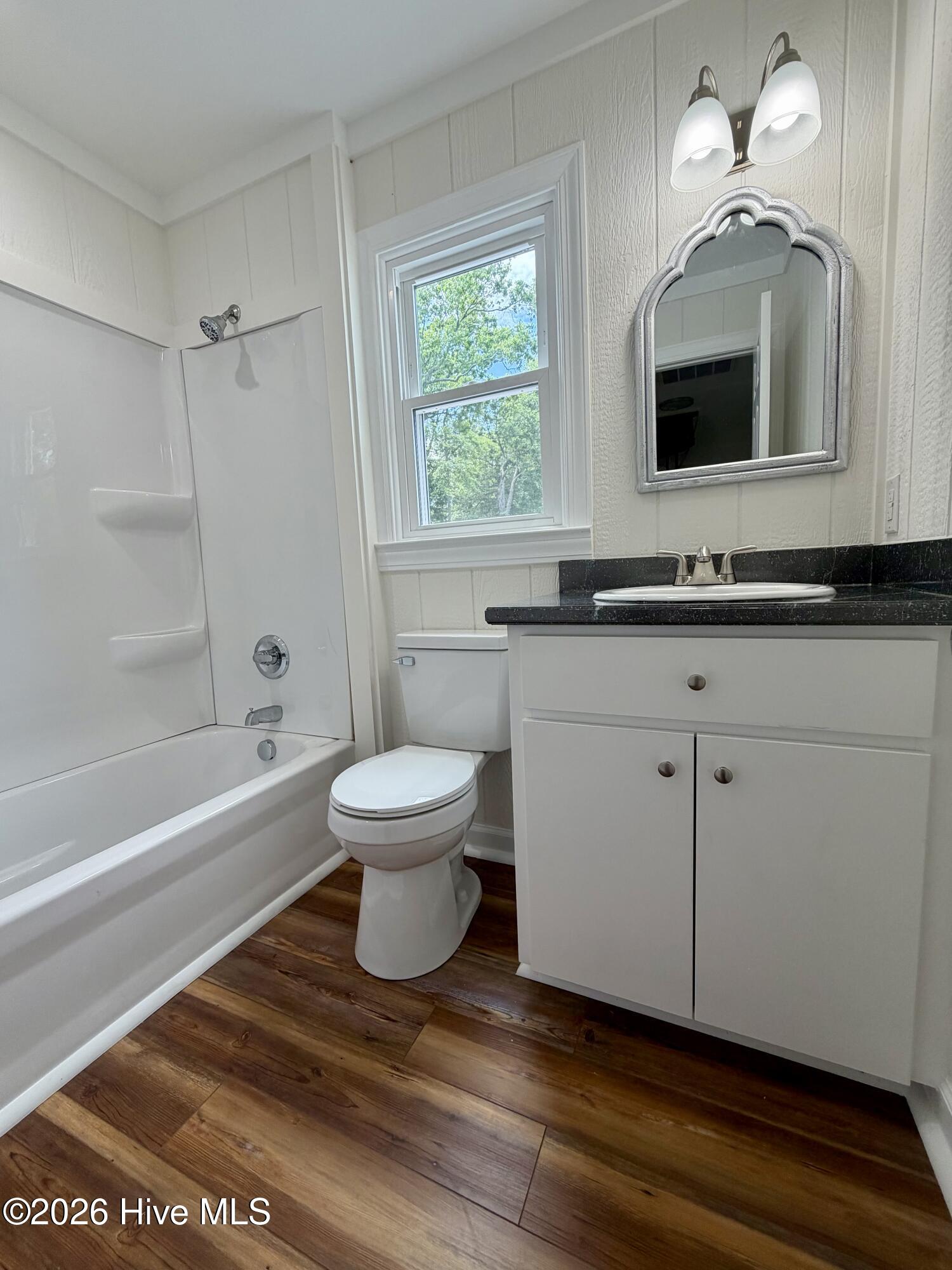 2443 Creekside Road Kinston, NC 28504 - Photo 50 of 60 Enjoy a new shower, toilet, vanity, and lighting.