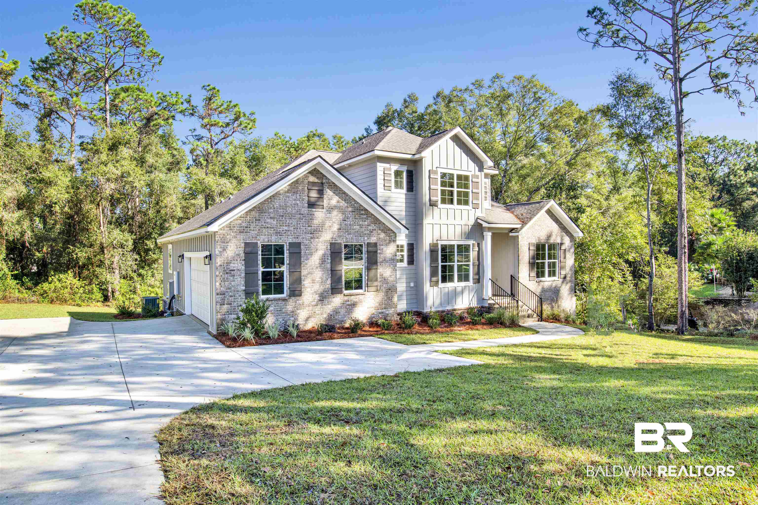 5 Long Leaf Circle Fairhope, AL 36532 - Photo 2 of 44 View of front of property with a garage and a front lawn