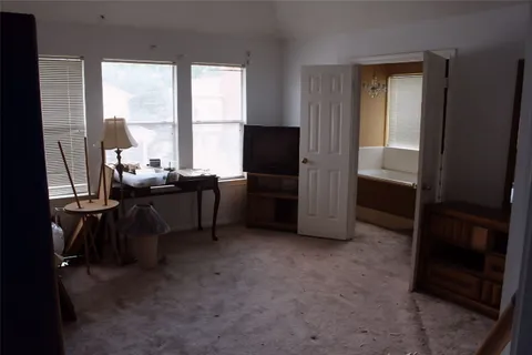 a room with furniture and a window