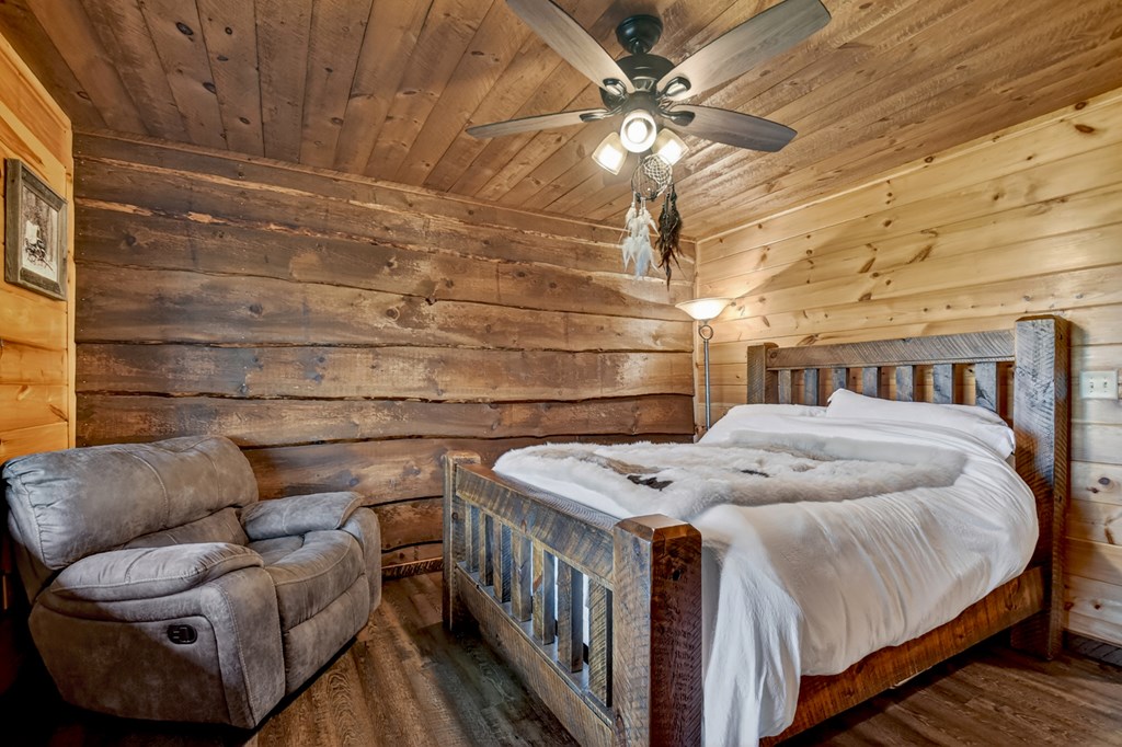 459 Quail Ridge Road Epworth, GA 30541 - Photo 67 of 73 a bedroom with a bed and a ceiling fan