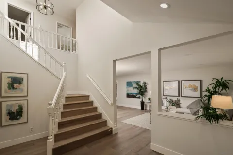 a view of an entryway with wooden floor and windows