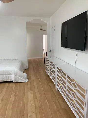 a living room with a couch and a flat screen tv