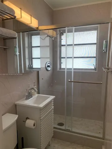 a bathroom with a sink and mirror