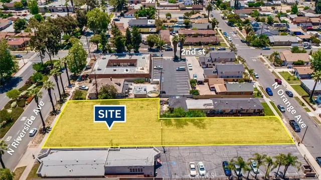 an aerial view of residential houses with swimming pool