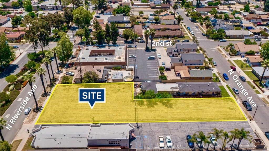 210 North Riverside Avenue Rialto, CA 92376 - Photo 1 of 7 an aerial view of residential houses with swimming pool