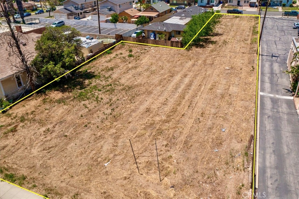 210 North Riverside Avenue Rialto, CA 92376 - Photo 5 of 7 a view of a yard with wooden fence