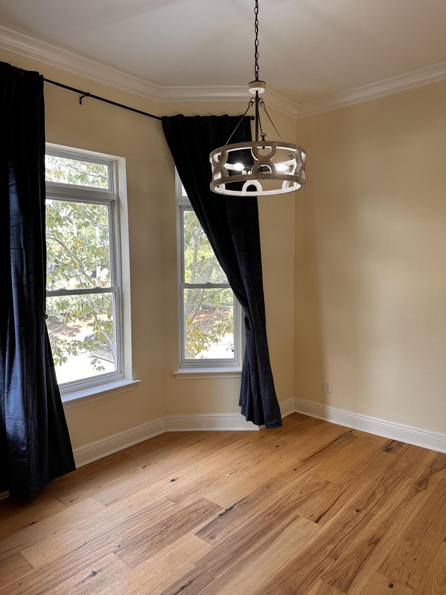 56 Spires Lane, Unit E16 Santa Rosa Beach, FL 32459 - Photo 12 of 17 a view of a livingroom with a window and wooden floor