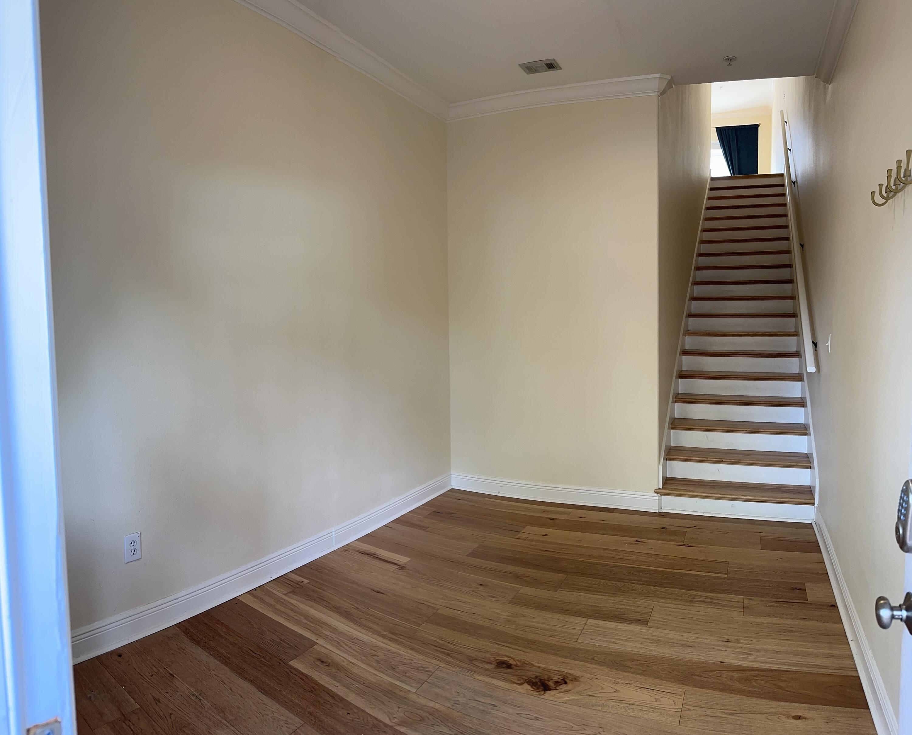 56 Spires Lane, Unit E16 Santa Rosa Beach, FL 32459 - Photo 16 of 17 a view of an empty room with wooden floor and a window
