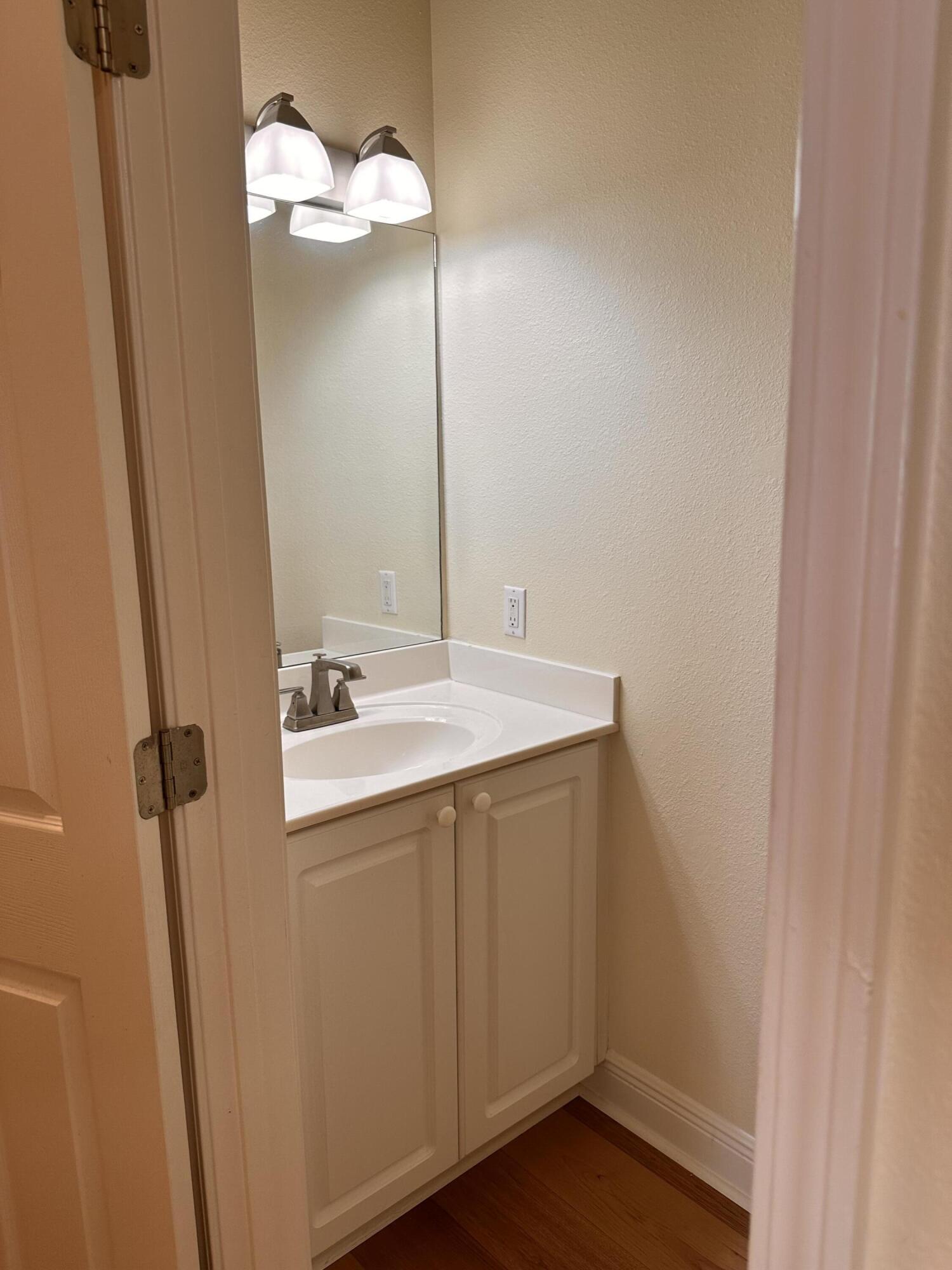 56 Spires Lane, Unit E16 Santa Rosa Beach, FL 32459 - Photo 9 of 17 a bathroom with a sink and a mirror